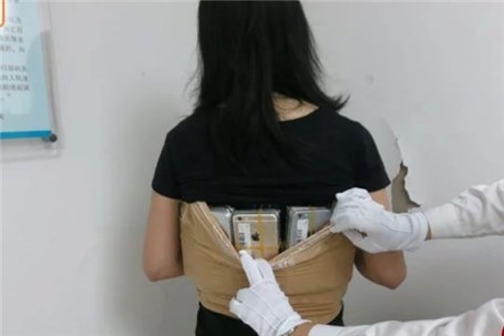 شگرد عجیب زن جوان هنگ کنگی برای قاچاق ۱۰۲ گوشی آیفون به چین + تصاویر